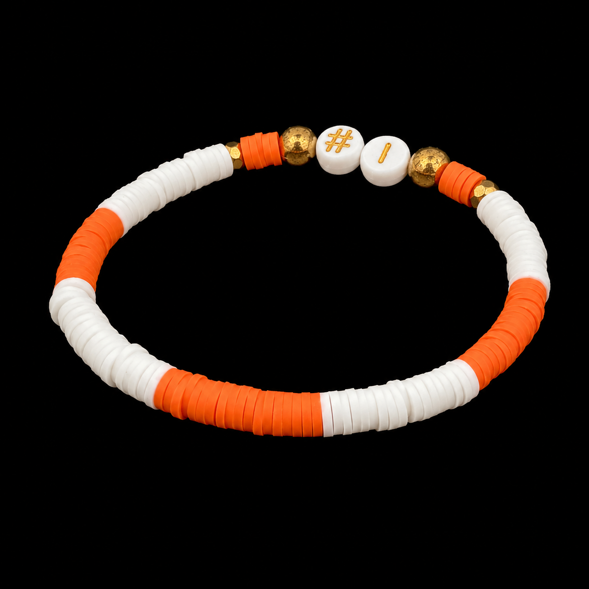 Orange and white #1 game day beaded stretch bracelet shown at an angle on black reflective surface
