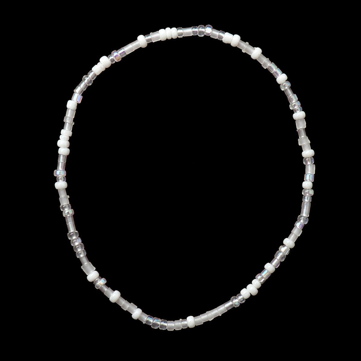 White and iridescent seed bead stretch bracelet with clear bugle beads and crystal rondelles displayed flat in a circle on black background
