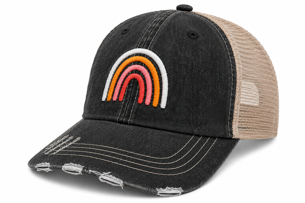 Side view of Boho Rainbow trucker hat in distressed black with tan mesh back and embroidered rainbow design, shown on a white background.
