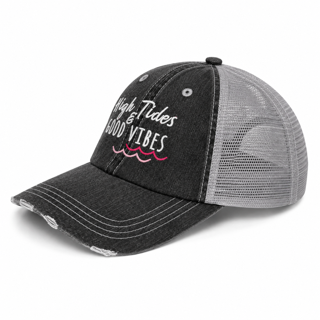 Side view of High Tides & Good Vibes trucker hat showing distressed black denim front, light gray mesh back, and pink wave embroidery detail.
