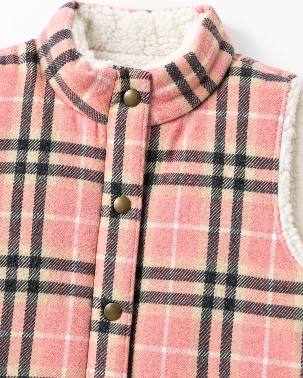 Close-up of the pink plaid vest showing its stand-up collar, bronze-tone snaps, and white sherpa-style fleece lining
