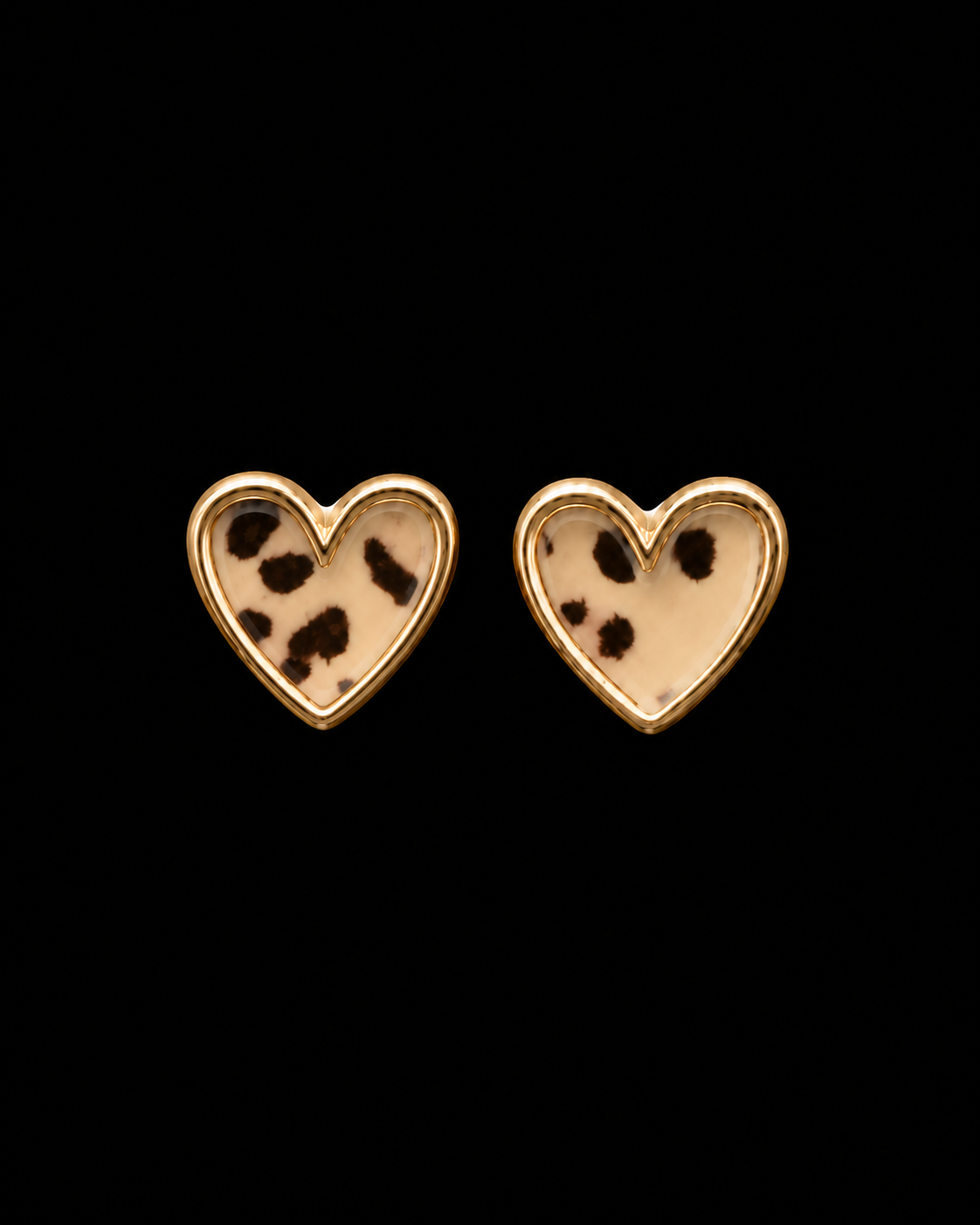 Leopard print heart stud earrings with polished gold-tone bezel trim shown as a pair front-facing on black background
