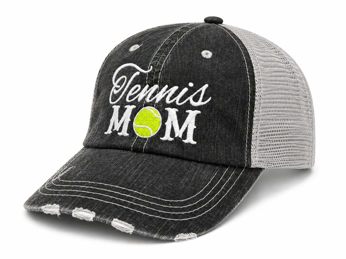 Side angle view of the Tennis Mom Trucker Hat showing distressed charcoal front, embroidered design, and light gray mesh back
