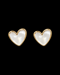 Pearl heart stud earrings with polished gold-tone bezel trim shown as a pair front-facing on black background

