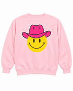 Front view of the light pink sweatshirt with a yellow smiley face wearing a hot pink cowboy hat outlined in black
