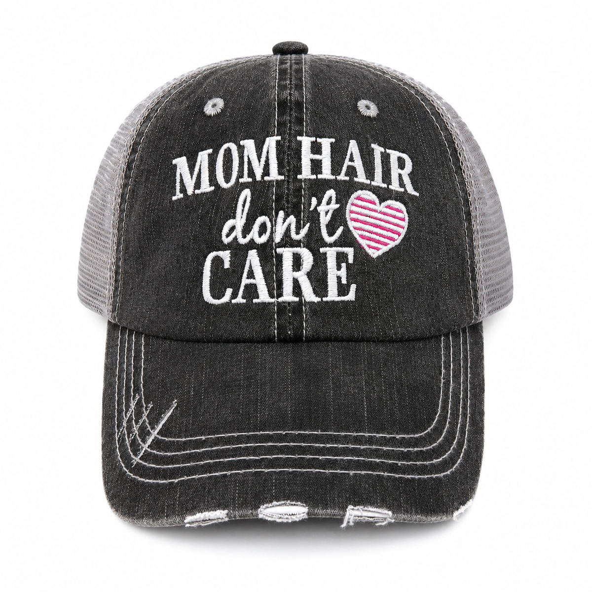Mom Hair Don't Care Trucker Hat front view, distressed charcoal with gray mesh back and pink striped heart embroidery
