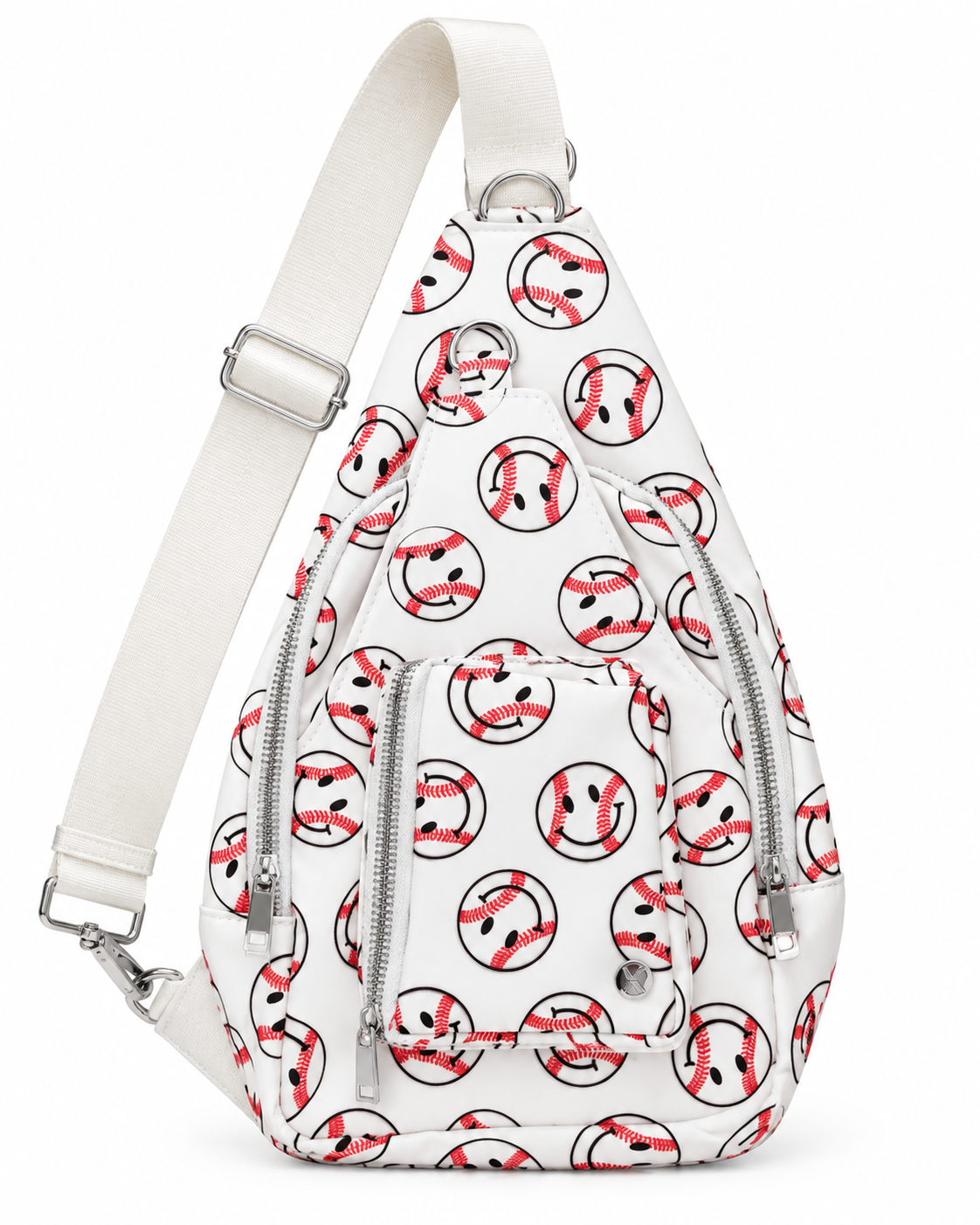 Baseball Smiley Sling Bag three-quarter angle view with white all-over baseball smiley face print, two front silver zipper compartments, small front zippered pocket, and wide flat cream adjustable strap with silver D-ring and swivel clip on white background
