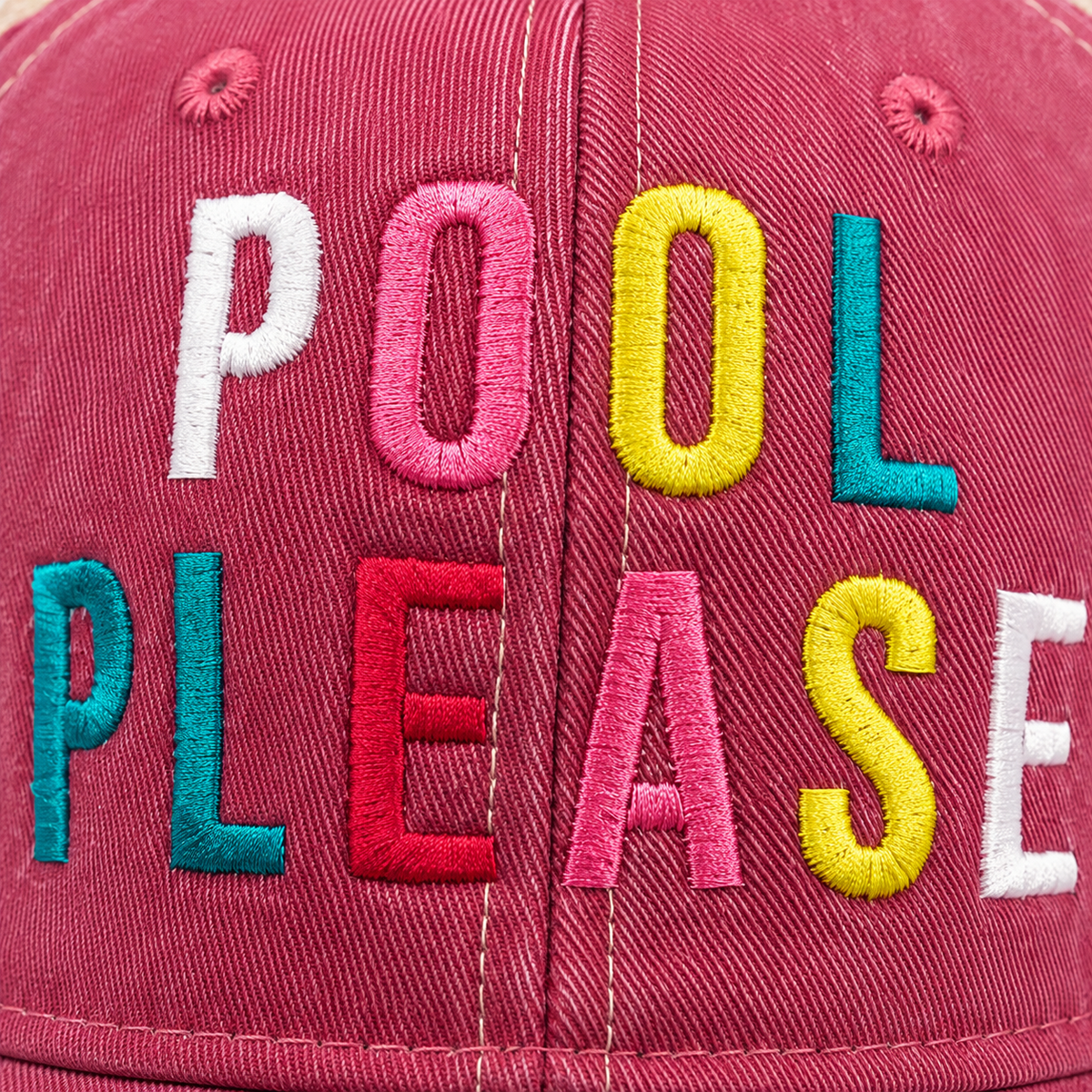 Close-up of colorful Pool Please embroidery on distressed pink trucker hat showing detailed stitched lettering.
