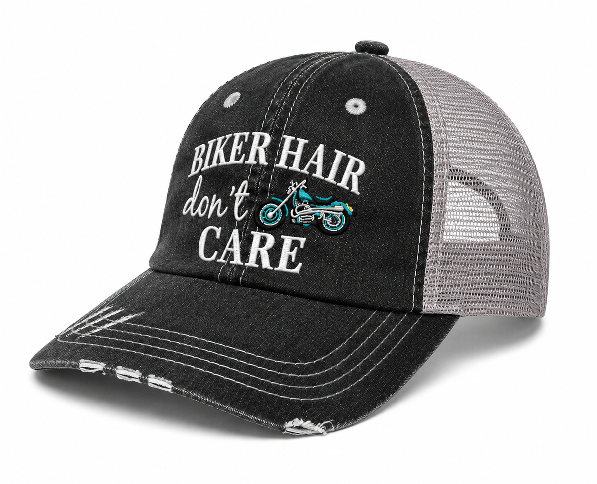Side view of Biker Hair Don’t Care trucker hat with distressed black front, motorcycle embroidery and gray mesh back