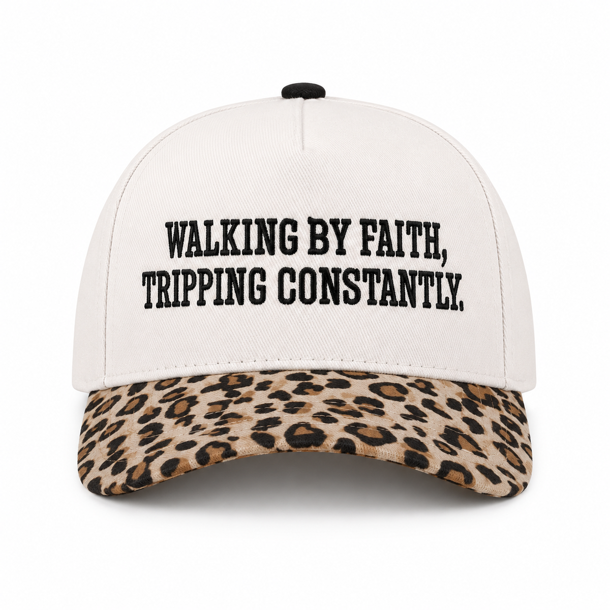 Walking By Faith Tripping Constantly Baseball Cap in Leopard front view showing cream structured cotton crown with black embroidered Walking By Faith Tripping Constantly block lettering, tan and brown leopard print bill, and black top button on white background
