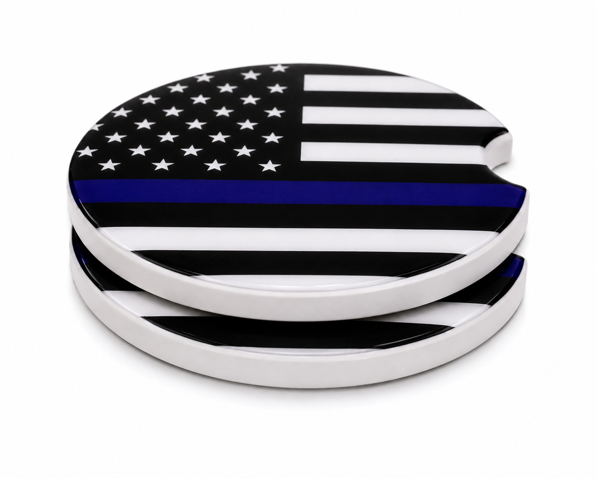 Thin Blue Line ceramic car coasters stacked showing thickness and finger notch cutout, black and white American flag with blue stripe design, set of 2
