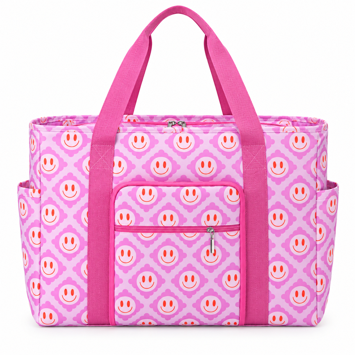 Pink Smiley Flower Weekender Bag front view showing light pink and lavender all-over smiley face quatrefoil print with hot pink webbed handles, vertical pink trim straps, front silver-zip slip pocket above hot pink zippered front pocket, and zippered main compartment on white background
