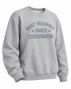 Angled front view of the Snack Coordinator sweatshirt showing its long sleeves and ribbed cuffs and hem
