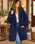 Model wearing a navy sherpa hooded body wrap cardigan with an open front and long sleeves

