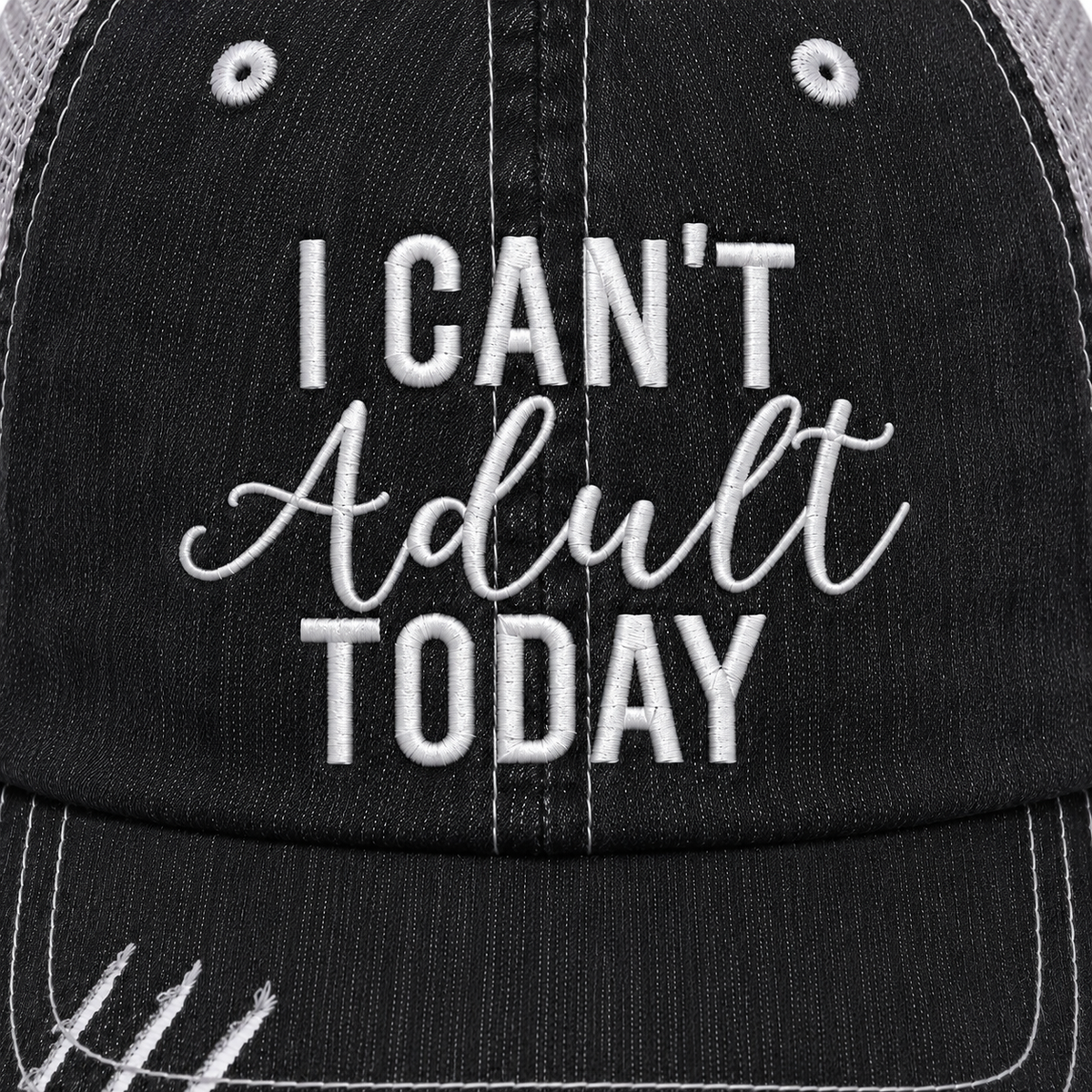 Close-up of I Can't Adult Today trucker hat showing white embroidered lettering on distressed black denim front panel.