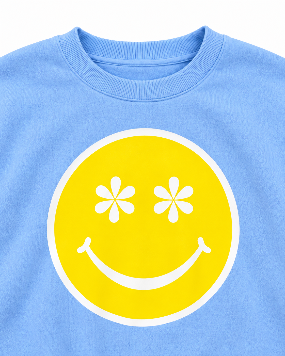 Close-up of the yellow happy face with white daisy eyes and the ribbed neckline on the light blue sweatshirt
