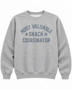 Front view of the heather gray Most Valuable Snack Coordinator sweatshirt with distressed lettering and star accents
