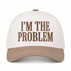 I'm the Problem Baseball Cap in Ash Mocha front view showing cream cotton crown with mocha raised serif block I'm the Problem embroidery, mocha bill, and mocha top button on white background
