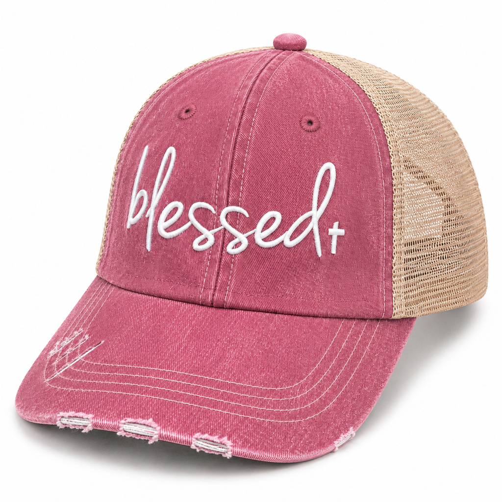 Side view of Blessed+ dusty rose trucker hat with white embroidered script, distressed bill, and tan mesh back.