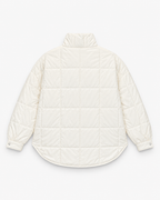 Back view of the white quilted puffer pullover jacket showing its gathered snap-button cuffs.
