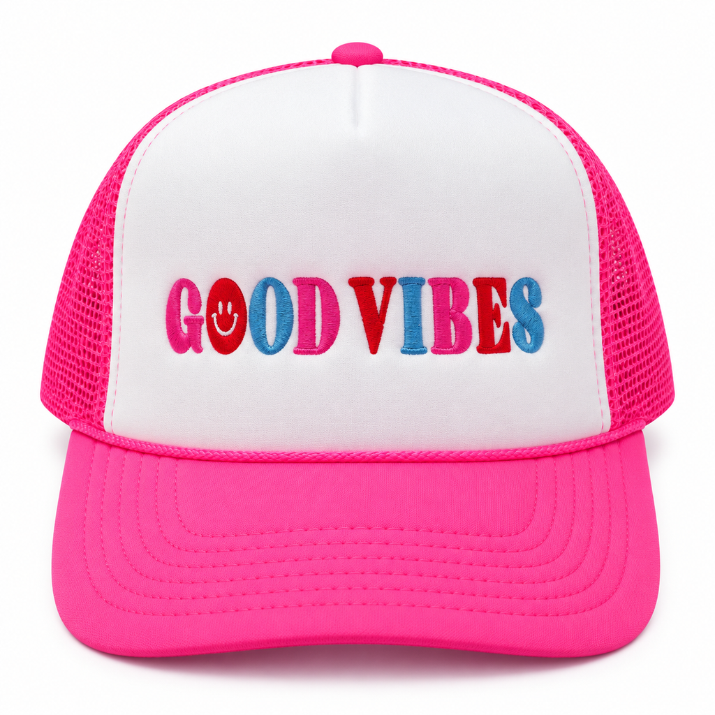 Good Vibes Trucker Hat front view with white structured front, hot pink bill and mesh back, and multicolor embroidered Good Vibes lettering with smiley face detail on white background
