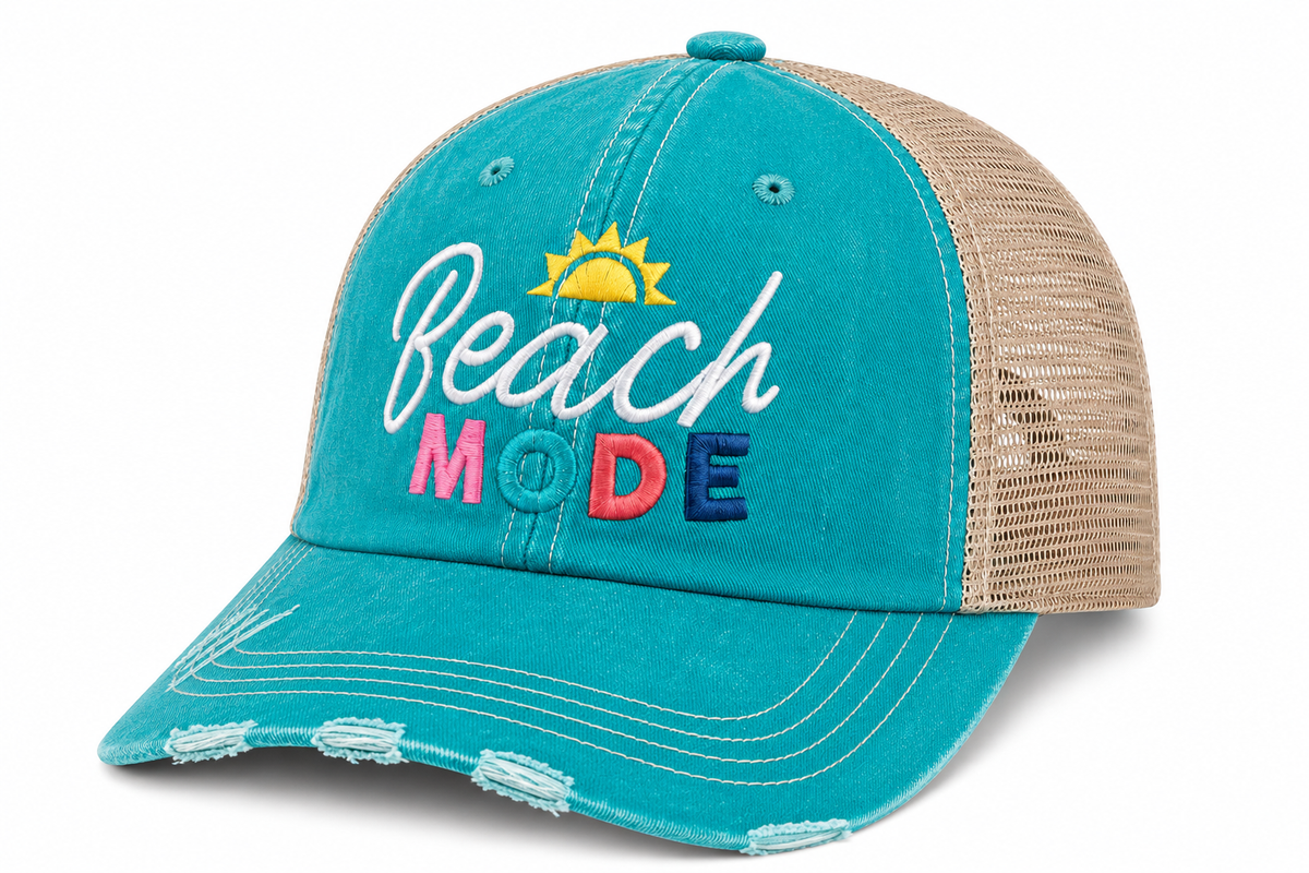 Side view of Beach Mode trucker hat in teal with tan mesh back and colorful "Beach Mode" embroidered patch, shown on a white background.
