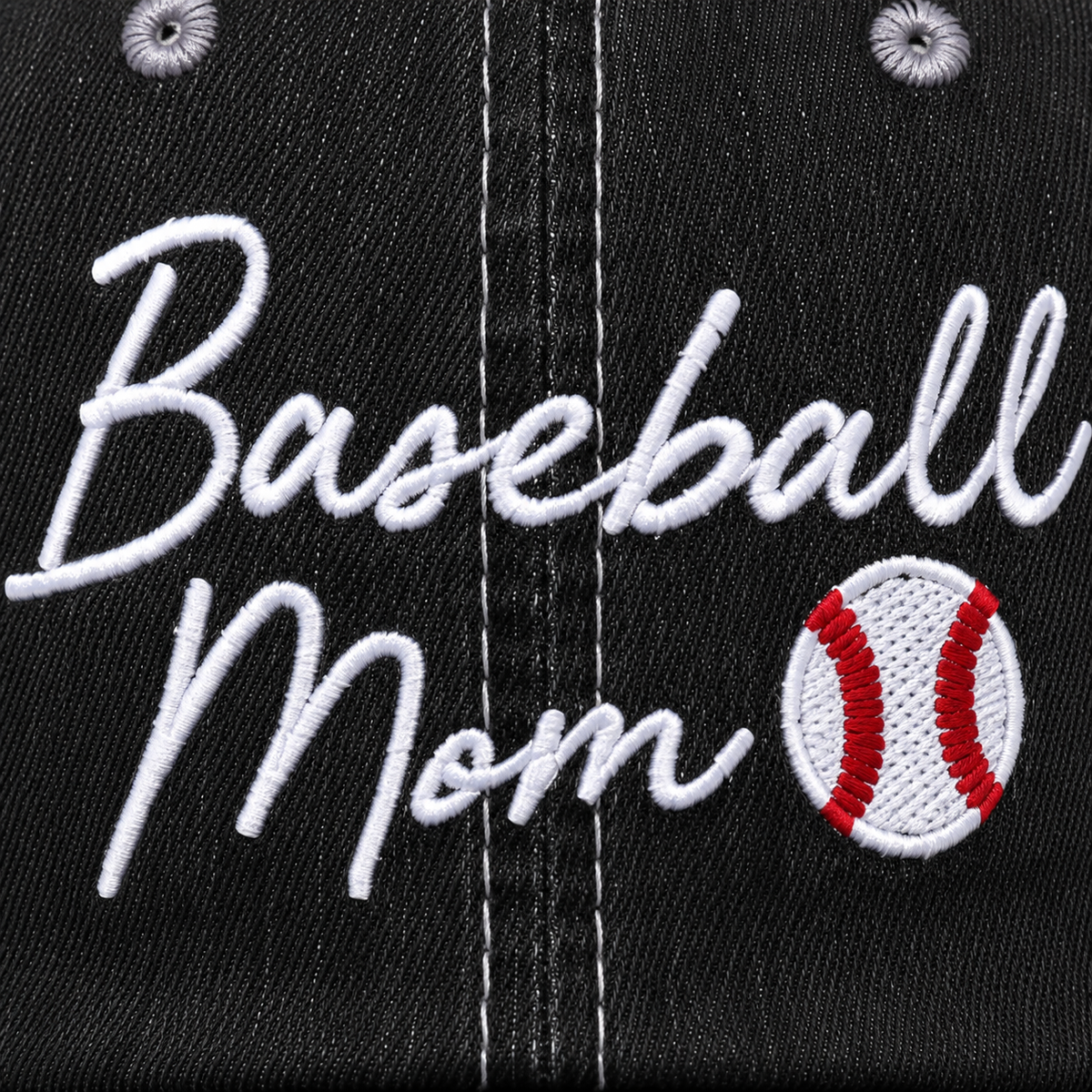 Close-up of white embroidered "Baseball Mom" script with baseball accent on a distressed black trucker hat front panel.
