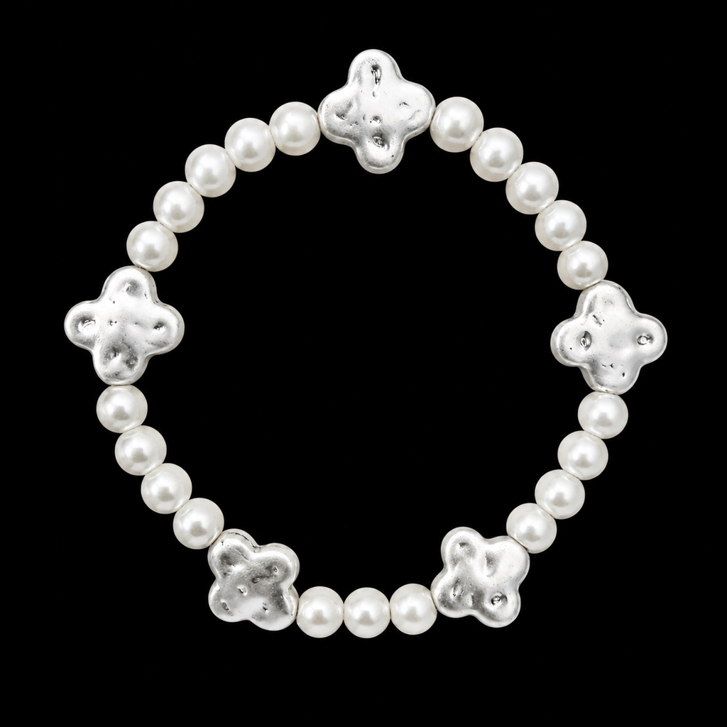 Pearl bead stretch bracelet with five evenly spaced hammered silver-tone clover accents displayed flat in a circle on black background

