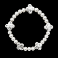 Pearl bead stretch bracelet with five evenly spaced hammered silver-tone clover accents displayed flat in a circle on black background
