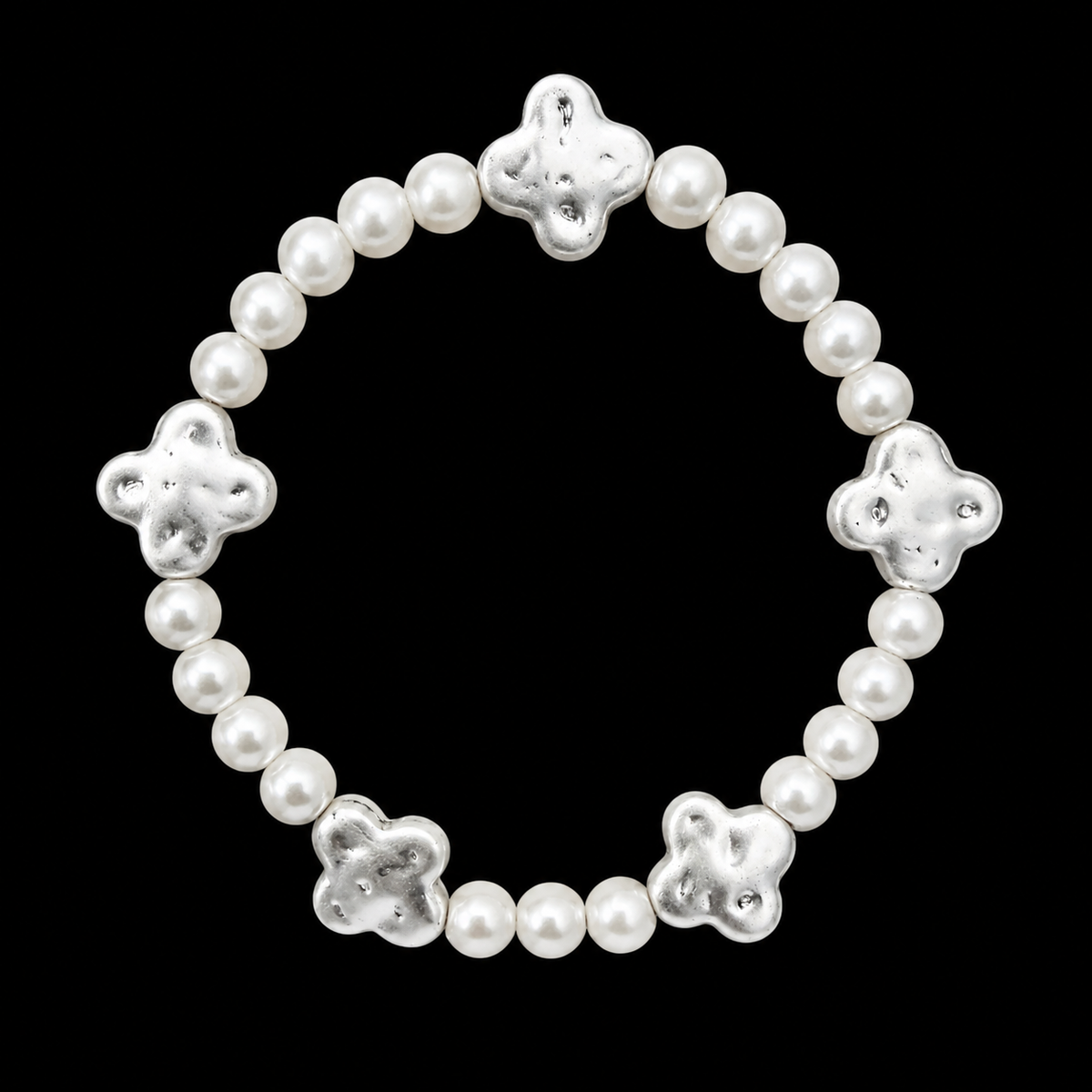Pearl bead stretch bracelet with five evenly spaced hammered silver-tone clover accents displayed flat in a circle on black background
