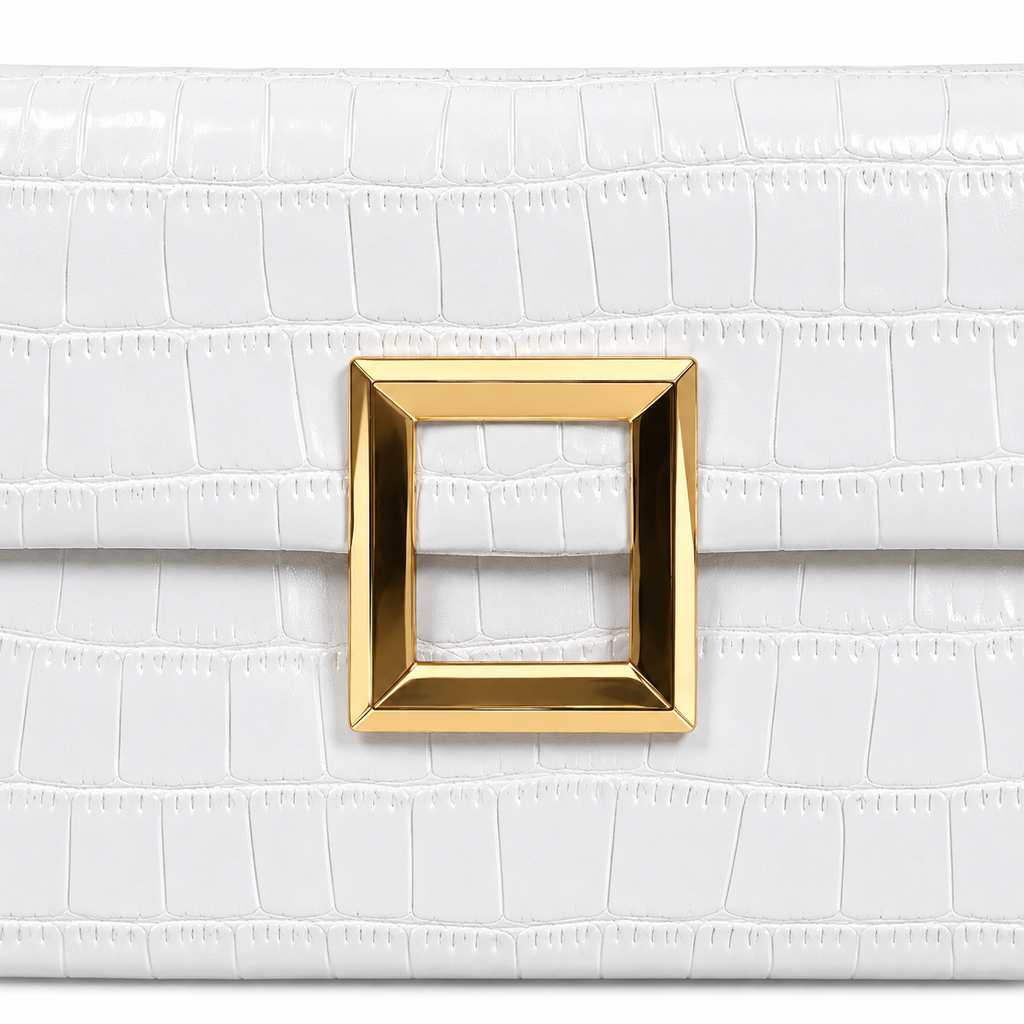 Close-up of White Croc Envelope Clutch showing beveled polished gold open square frame hardware accent on white croc-embossed vegan leather with glossy texture and horizontal scale pattern detail

