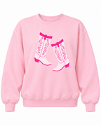 Front view of the pink sweatshirt featuring two white cowboy boots with hot pink outlines and Western detailing
