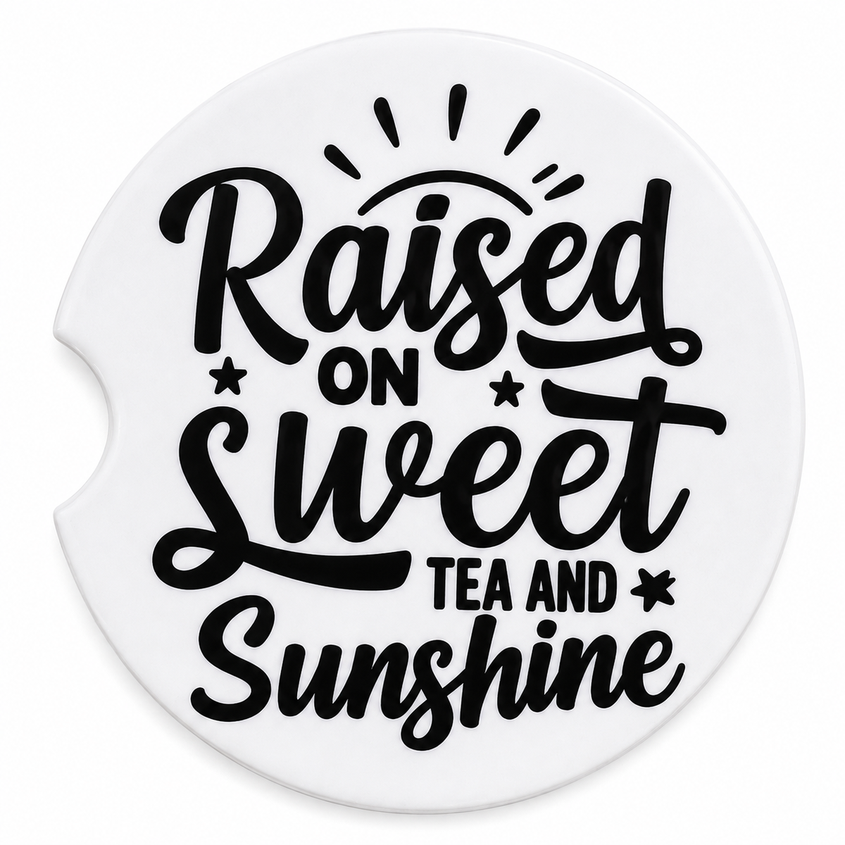 Raised on Sweet Tea and Sunshine ceramic car coaster — bold black script with sun rays and star accents on white, angled view showing finger notch cutout
