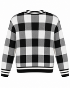 Back view of Black and White Plaid Gold Button Knit Cardigan showing black, white, and gray plaid knit back panel with black and white striped ribbed hem and ribbed cuffs on white background
