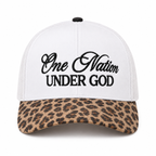 One Nation Under God Baseball Cap in Leopard front view showing white structured cotton crown with bold black embroidered script reading One Nation Under God in cursive and block lettering, tan and black leopard print bill, and black top button on white background
