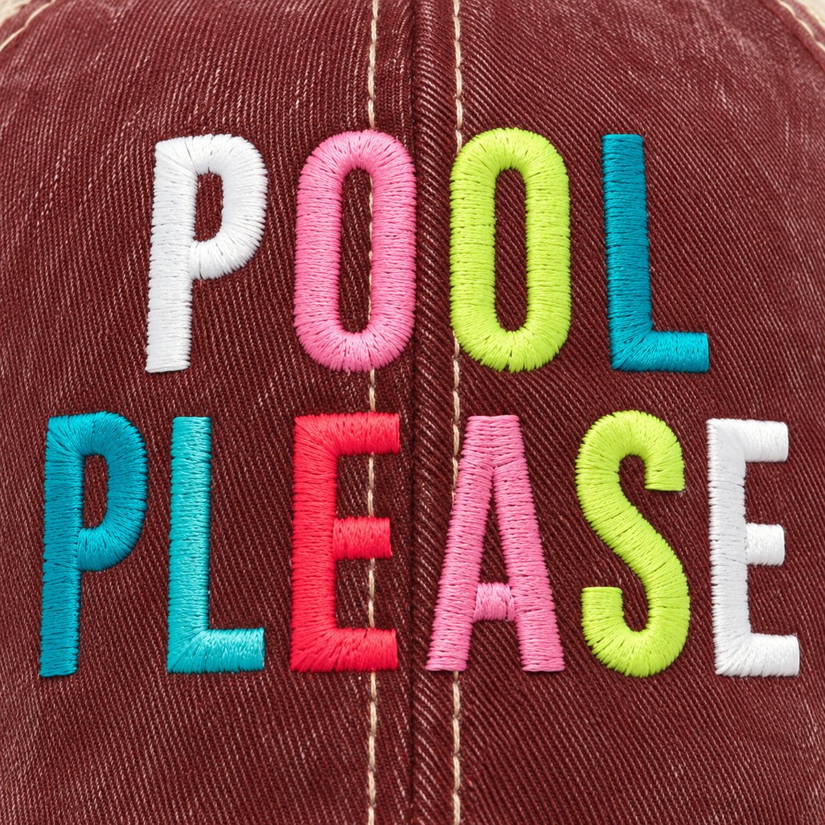 Close-up of multicolor embroidered Pool Please lettering in white pink lime green teal and red on distressed burgundy trucker hat front panel
