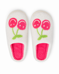 White cozy slippers with pink smiley cherry design and bright pink footbed, top view
