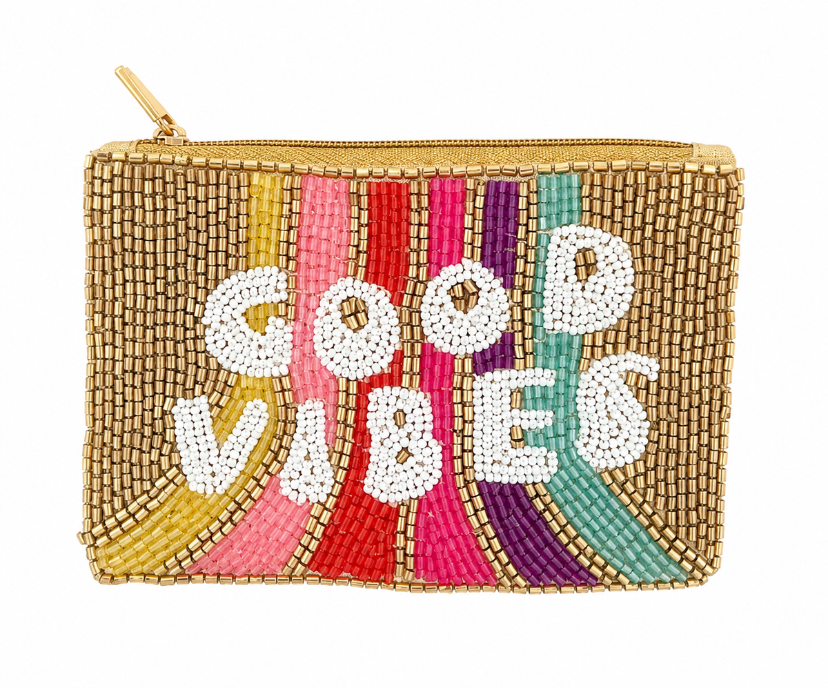 A rectangular gold-tone beaded pouch with a gold zipper, featuring the words 'GOOD VIBES' in white beads over vertical stripes of yellow, pink, red, purple, and teal.