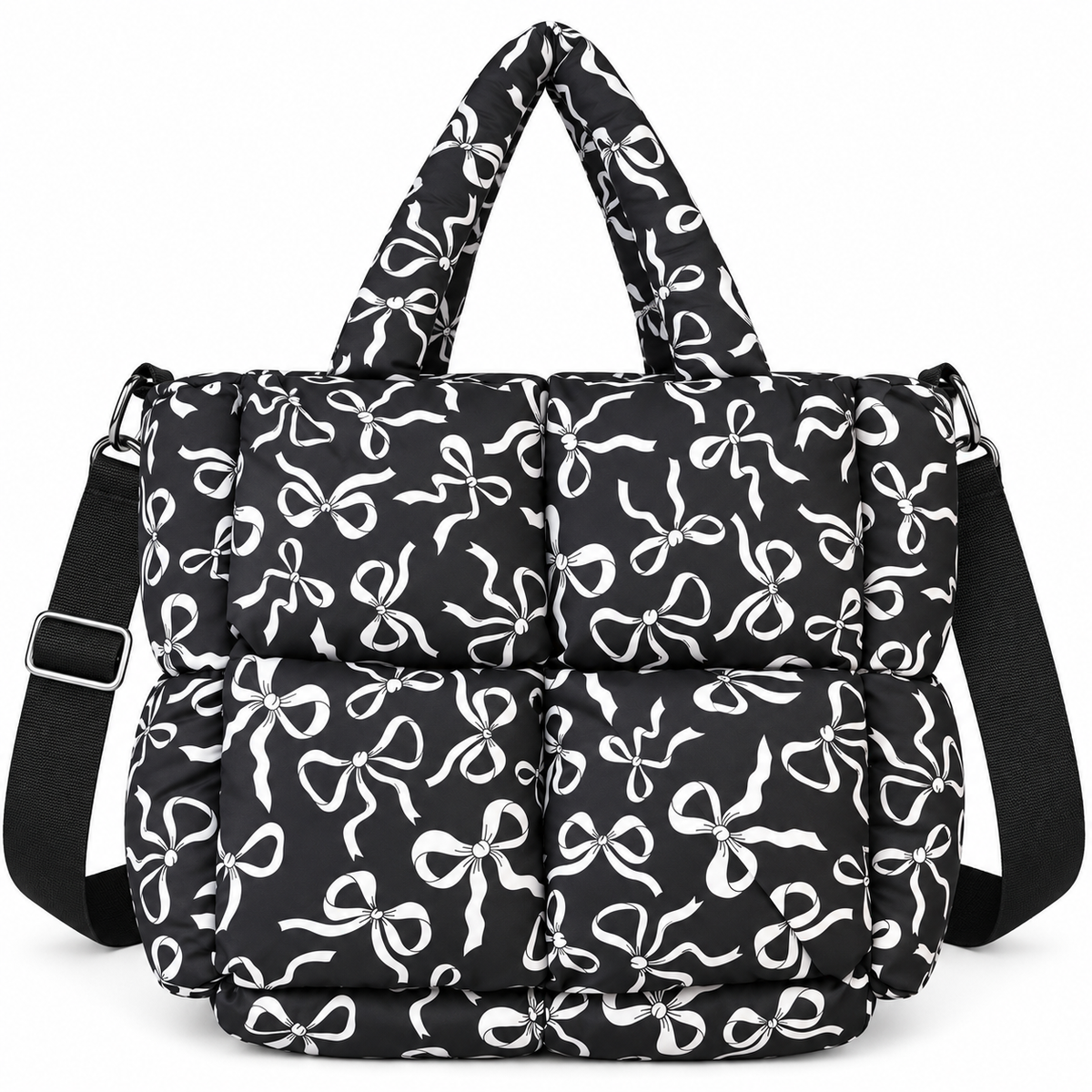 Black Bow Print Puffer Tote front view with black puffer body covered in all-over white bow print, dual padded top handles, adjustable black crossbody strap, and silver hardware on white background

