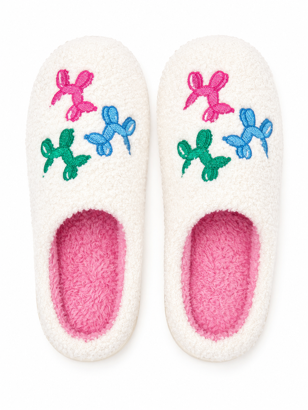 Ivory Balloon Dog Fuzzy Slippers flat lay showing colorful embroidered balloon dog accents in pink, blue, and green on ivory fuzzy exterior with bright pink interior lining
