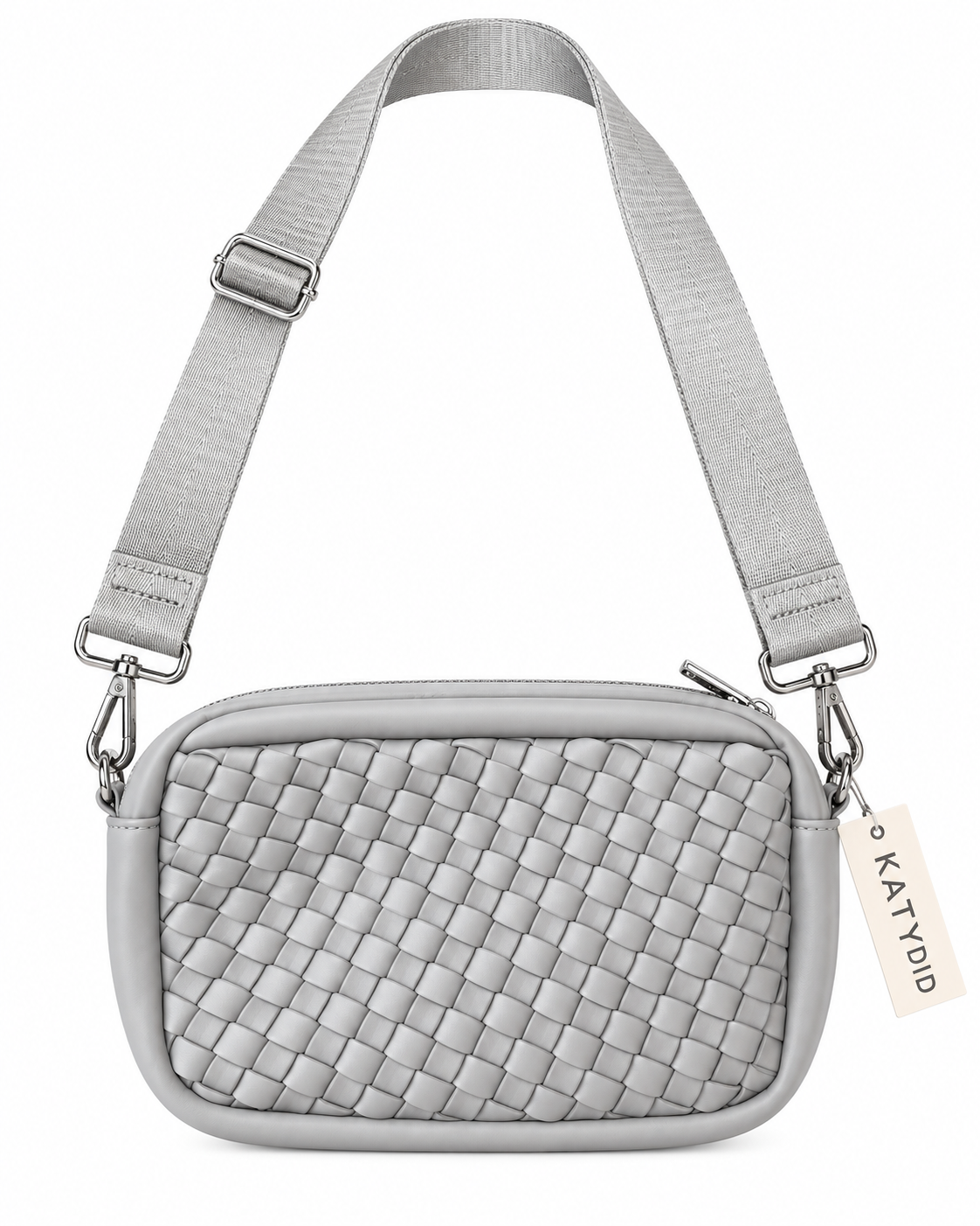Gray Woven Crossbody Bag front view with light gray interlaced woven panel, smooth gray trim, top zipper closure, adjustable wide gray webbing strap with silver swivel clips, and Katydid hang tag on white background
