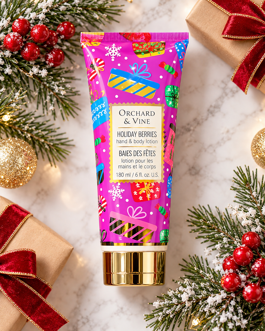Holiday Berries hand and body lotion laid flat among wrapped gifts with red bows, gold ornaments, and frosted evergreen branches
