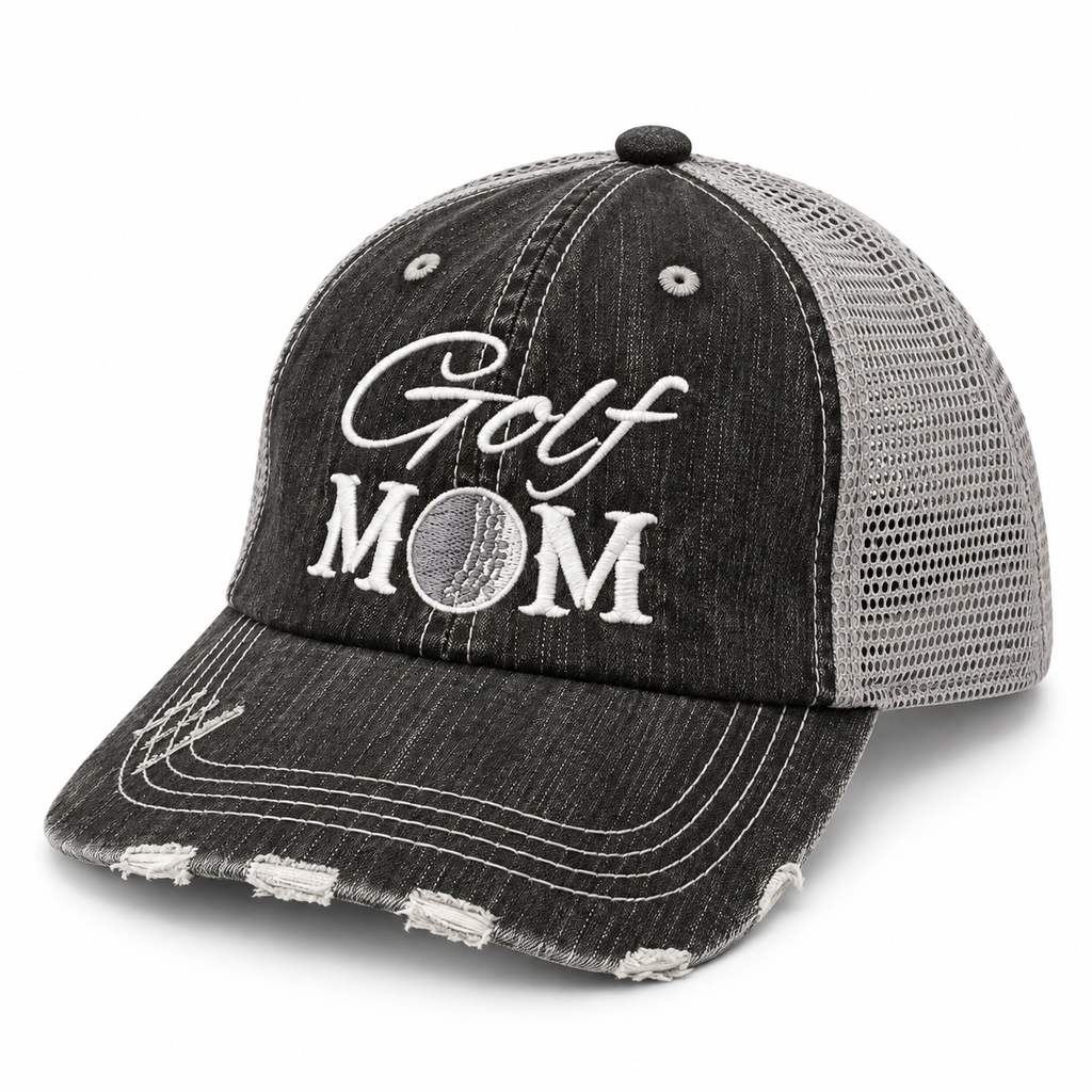 Golf Mom Trucker Hat three-quarter angle view showing distressed black front, gray mesh back, and white embroidered Golf Mom lettering with golf ball detail on white background

