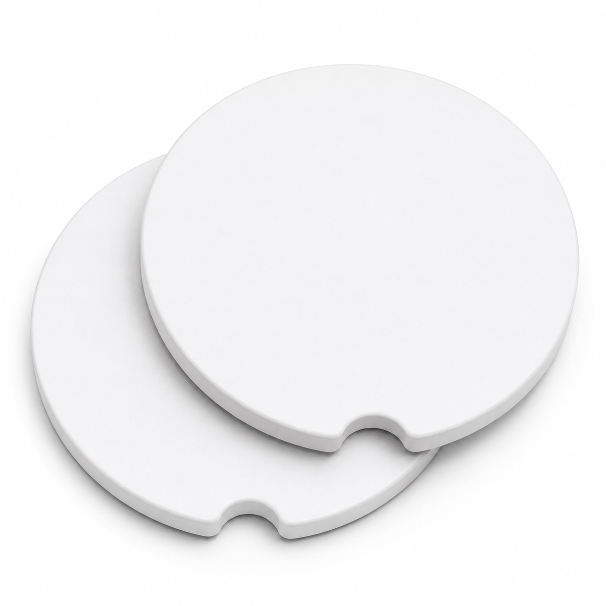 Two blank round ceramic car coasters stacked with white finished edges and finger notch cutouts, shown on a white background.
