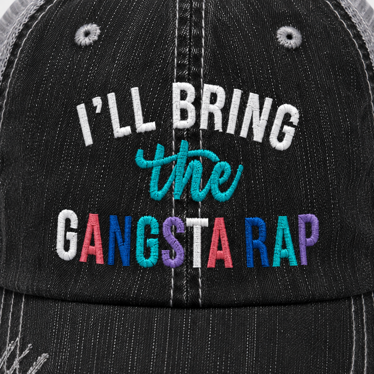  Close-up of I’ll Bring the Gangsta Rap trucker hat showing colorful embroidered lettering and distressed black denim detail.