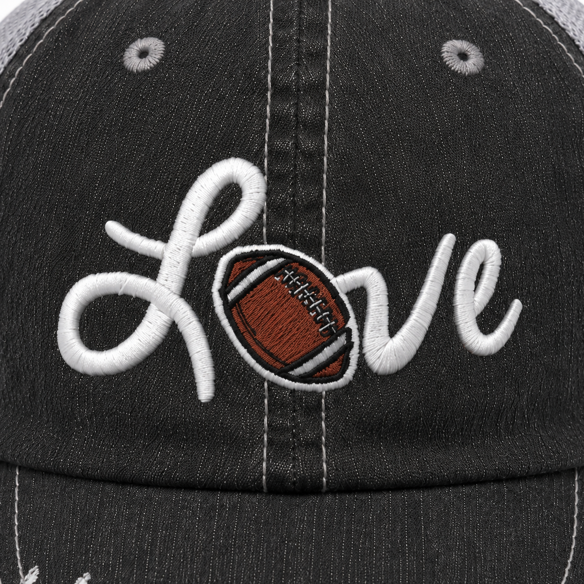 Close-up of Love Football trucker hat showing raised white script embroidery with a detailed brown football replacing the letter O.