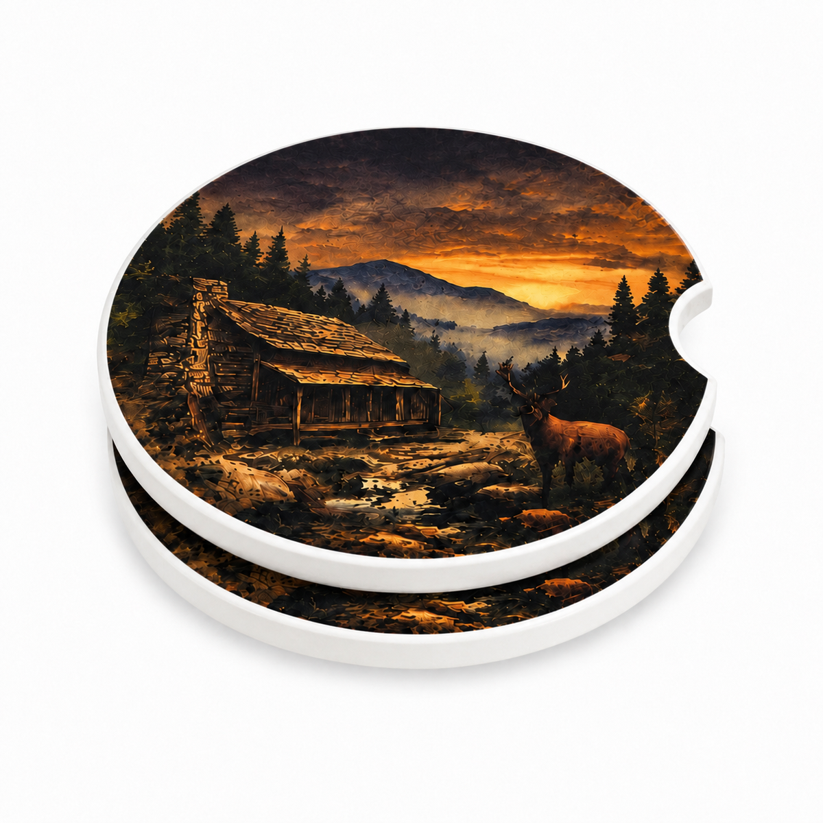 Mountain Cabin Sunset ceramic car coasters stacked showing thickness and finger notch cutout — rustic log cabin, deer, and orange sunset over misty mountains, set of 2
