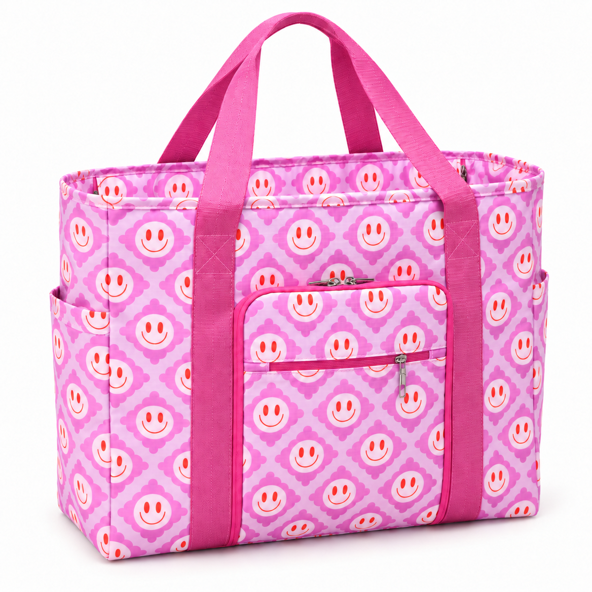 Pink Smiley Flower Weekender Bag three-quarter angle view showing light pink and lavender all-over smiley face quatrefoil print, hot pink webbed handles and vertical trim straps, front zippered pocket, and open side slip pocket on white background
