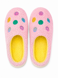 Pink Smiley Face Fuzzy Slippers flat lay showing colorful embroidered smiley face accents on pink fuzzy exterior with bright yellow interior lining