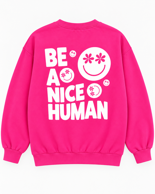 Full back view of the hot pink sweatshirt with white Be a Nice Human lettering and daisy-eye smileys